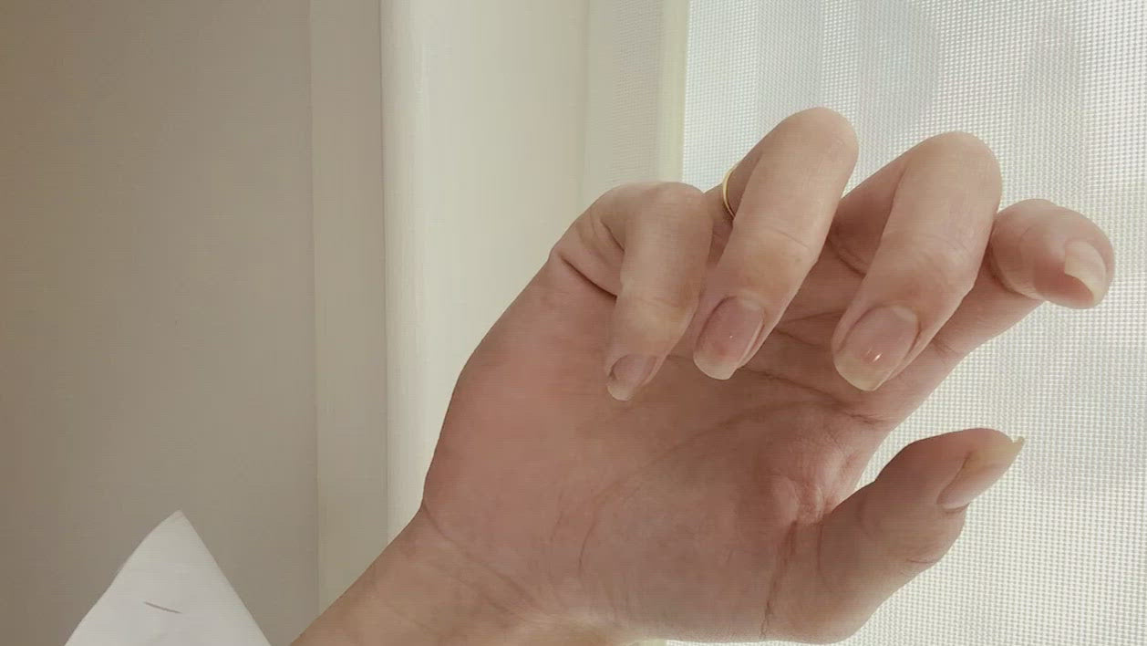 A hand showing well-manicured nails